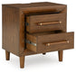 Lyncott King Upholstered Bed with Mirrored Dresser and Nightstand